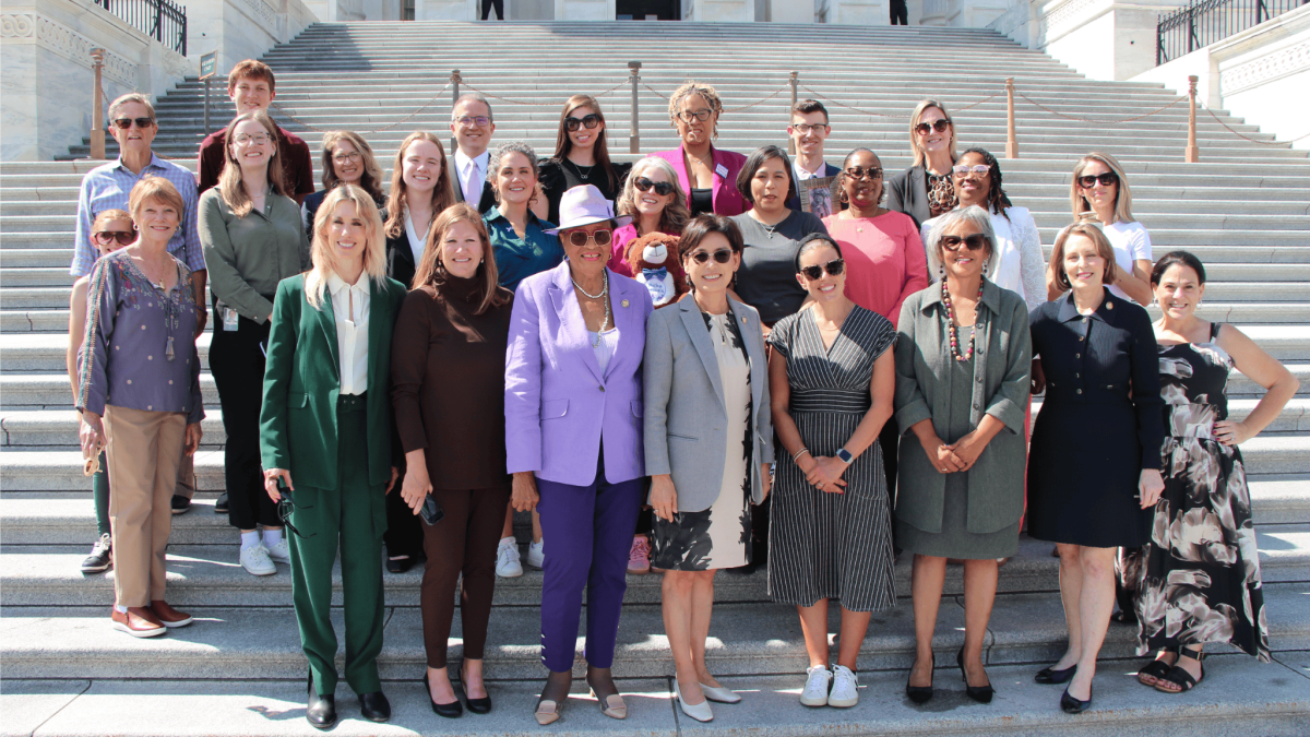Photo of Rep. Adams and advocates on the House steps