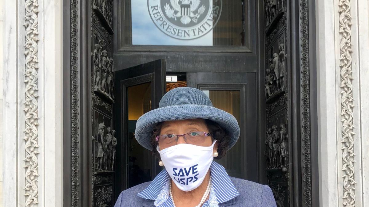 Alma Adams wearing a Save USPS facemask outside of the House of Reps
