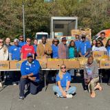 Rep. Adams outside with food bank volunteers