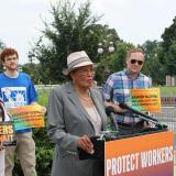Rep. Adams speaks at a podium for the Heat Illness Prevention Act press conference