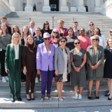 Photo of Rep. Adams and advocates on the House steps