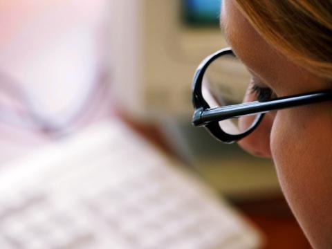 woman reading on a computer