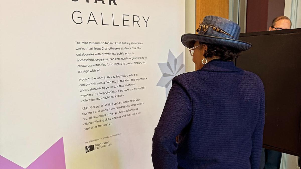 Rep. Adams looking at a museum exhibit