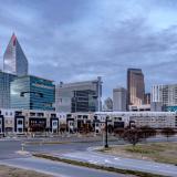 Apartments in front of Charlotte's skyline