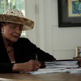 Alma at her desk