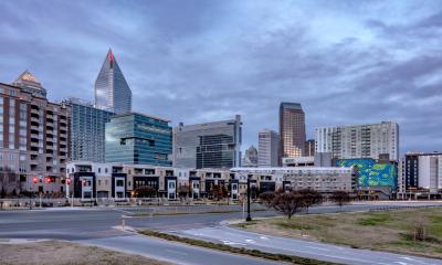 Apartments in front of Charlotte's skyline